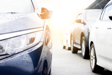 cars on the road drive for trip to travel or stop by traffic junction and jam on rush hours. with roof beside road.