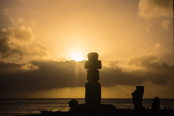 Moai silhouette during the sunset in easter island.