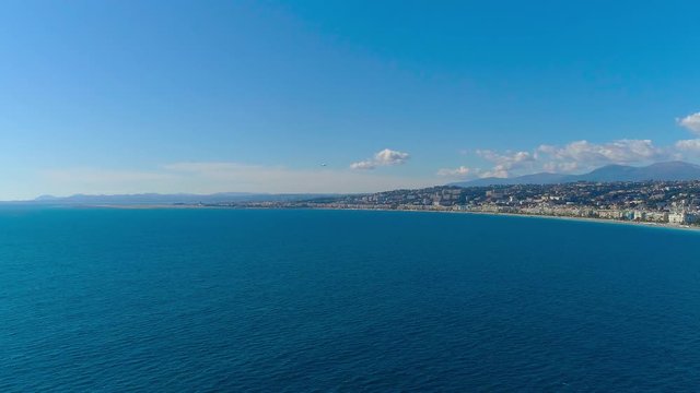 Aerial hyperlapse of plane landing in Nice airport on Mediterranean sea 4K