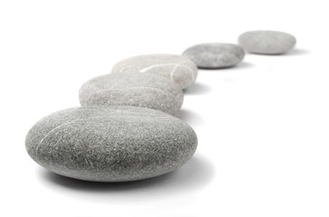 Fototapeta na wymiar pebble stones in line on white background
