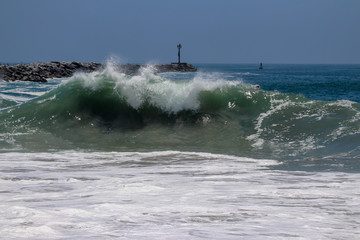 Large wave crashing at The Wedge in Newport Beach