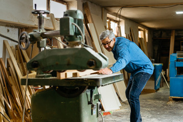 Working hard in his carpentry store