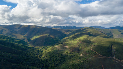 Aerial view of a landscape of green mountains.