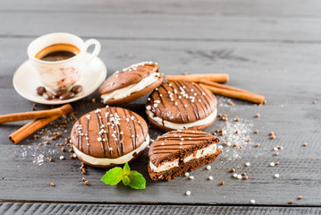 Tasty chocolate cookies on wooden background