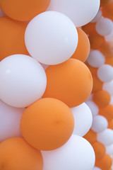 Garland, white and orange, balloons. Festive decoration.