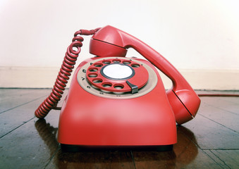 vintage red phone off the hook close up
