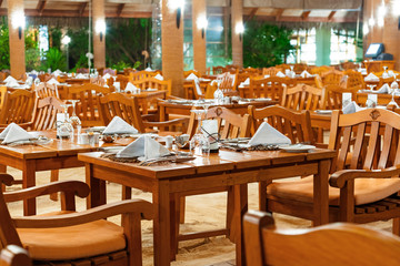 Glasses and plates on table in restaurant