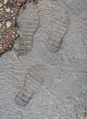 traces of shoes on cement