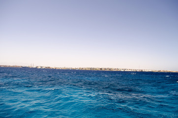 sea and sky shore in the distance