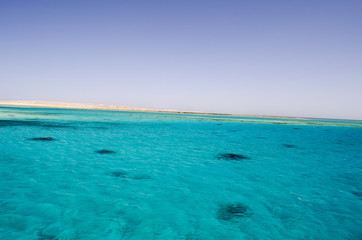 sea and sky shore in the distance
