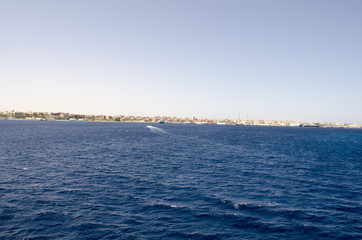 sea and sky shore in the distance