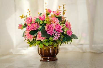 Beautiful artificial bouquet with on the window