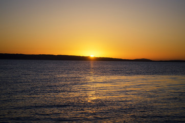 Fototapeta na wymiar a yellow sunset over the sea