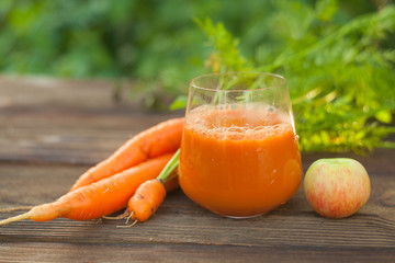 Carrot juice in glass on  table