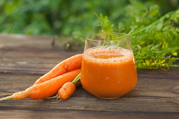 Carrot juice in glass on  table