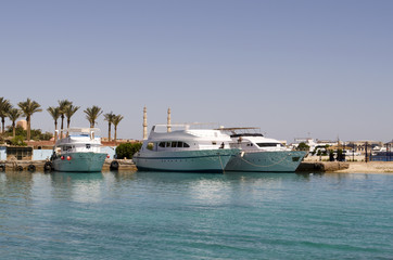 wharf with large yachts on the sea