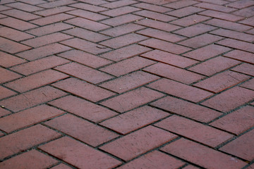 Cobble stone pavement surface pattern in red tone.