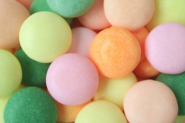 Fototapeta na wymiar Top view of delectable Pastel Colored Round Shaped Candies, for Background and Banner 