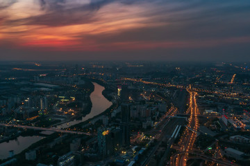 Fototapeta na wymiar Aerial view panorama of night city Moscow, Russia. Urban cityscape after sunset with illuminated streets and building