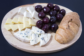 cheese plate on a dark background
