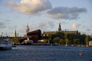 Boats, museums and landmarks on Djurgården island at sunset in Stockholm