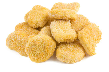 Frozen nuggets on a white background. Several chicken nuggets in breading close-up on a white background.