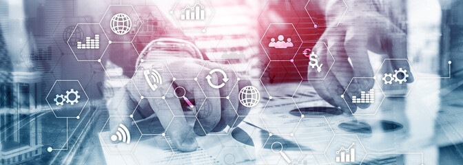 Double exposure mixed media. Diagrams and icons on hologram screen. Business people and modern city on background.