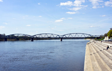View of bridge over the Wisla river and stairs, sunny day, beautiful landscape, Torun, Poland