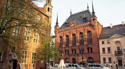 Torun, Poland - 04/19/2014 - Facade of Artus Court (Dwor Artusa), sunny day, Torun, Poland