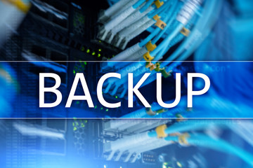 Backup button on modern server room background. Data loss prevention. System recovery.