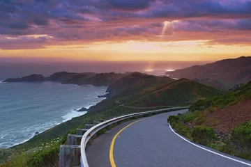 Fototapeten Beautiful colorful sunset viewed from the costal road, pacific coast near San Francisco, United States of America © Tunatura