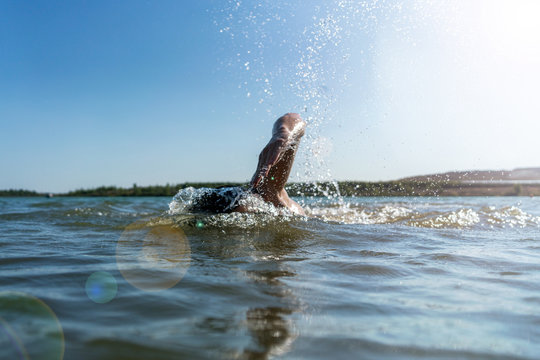 Man swimming in a lake background
