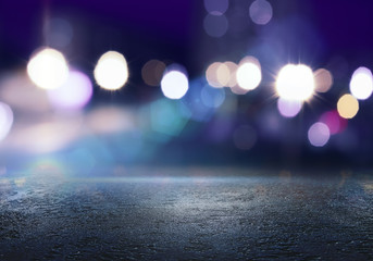 The background of an empty room with a concrete floor and blurred neon lights. Abstract blue...