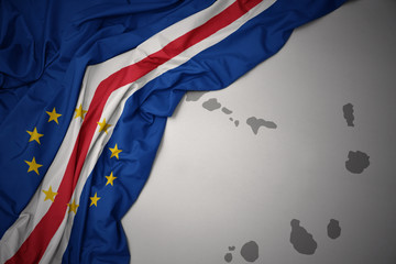 waving colorful national flag and map of cape verde.