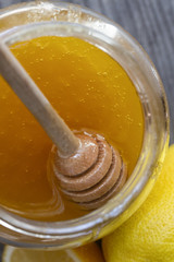 sweet thick golden homemade honey in the pot on top