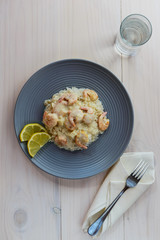 Shrimp in cream sauce with rice and lemon