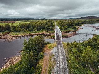 Steel railroad bridge over river in northern Finland