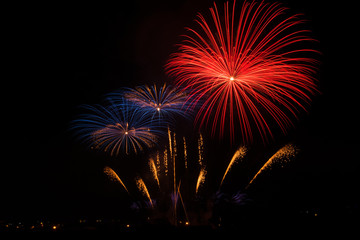 Colorful fireworks in dark sky during fireworks show