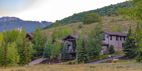 Three homes across of fields in Park City pano