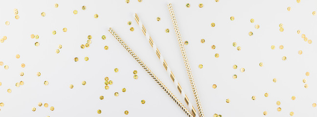 Cocktail party straws with golden sparkles