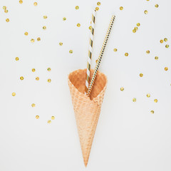 Golden party straws in waffle cone