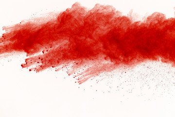Abstract red powder explosion on white background. abstract red dust splatted on white background,...