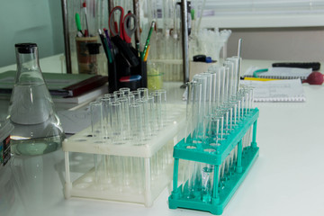 Glass test tubes are placed in a support