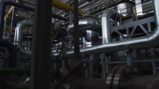 Electric power station. Scene. Panorama of the interior of power plant. Pipes in a industrial factory
