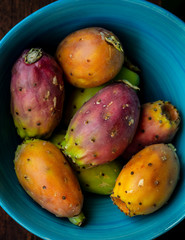 prickly pear fruits in a blue bowl