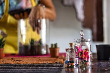 Woman planting terrarium for Christmas
