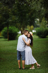 Fototapeta premium Romantic couple in the park at summer