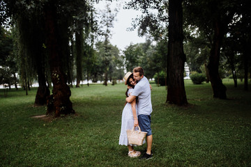 Fototapeta premium Romantic couple in the park at summer