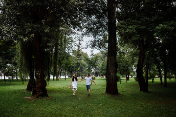 Fototapeta premium Pretty couple in the forest at summer 