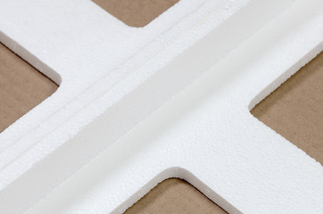 Background image with beige cardboard paper and styrofoam boxes disgarded as rubbish. The concept...